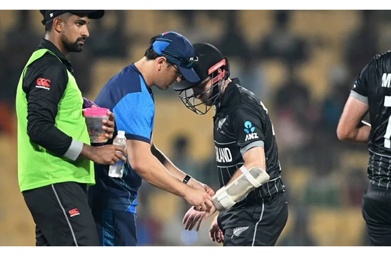 Kane Williamson was hit on his left thumb by a throw when completing a run  •  ICC/Getty