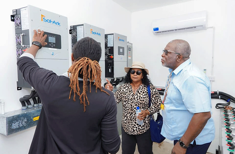 Prime Minister, Brigadier (Ret’d) Mark Phillips, inspects the battery energy storage system after commissioning the solar mini-photovoltaic (PV) farms, on Sunday, for the indigenous communities of Tapakuma Village and Capoey Mission