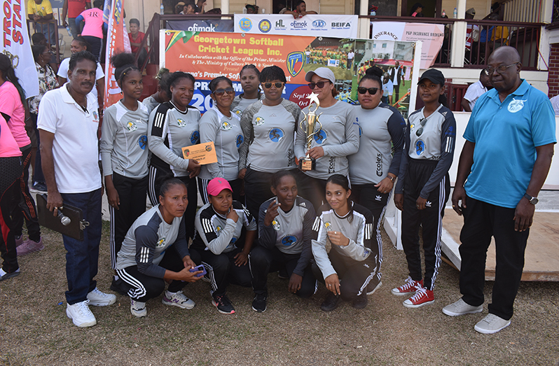 The victorious 4R Lioness players pose with their winnings.