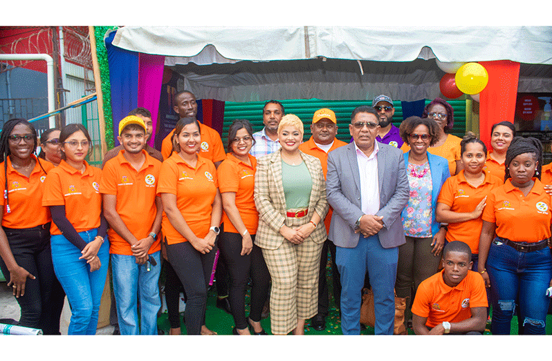 Minister of Agriculture Zulfikar Mustapha (centre right), and General Manager of GMC, Teshawna Lall (centre left), flanked by staff of the Guyana Shop and other officials (Shaniece Bamfield photo)