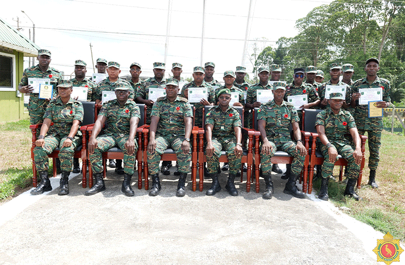 The 19 ranks with senior officers (seated) after completing the Grade Three Agriculture Course