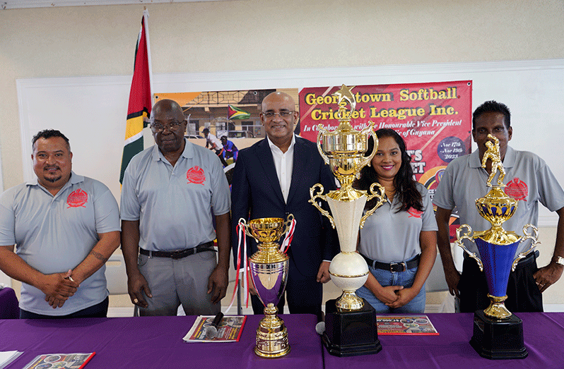 Telesha Ousman (left) presents Dr. Jagdeo with a plague of appreciation from the GSCL