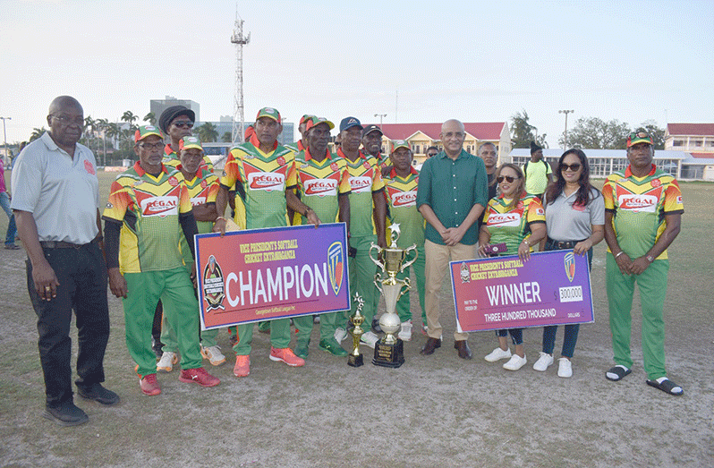 Vice-president Dr Bharat Jagdeo poses with the victorious Regal Legends players.