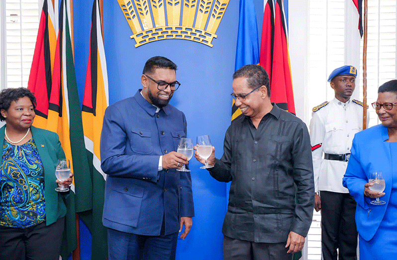 President Dr. Irfaan Ali takes a toast with Non-Resident High Commissioner of Barbados, David Comissiong after accepting his Letters of Credence