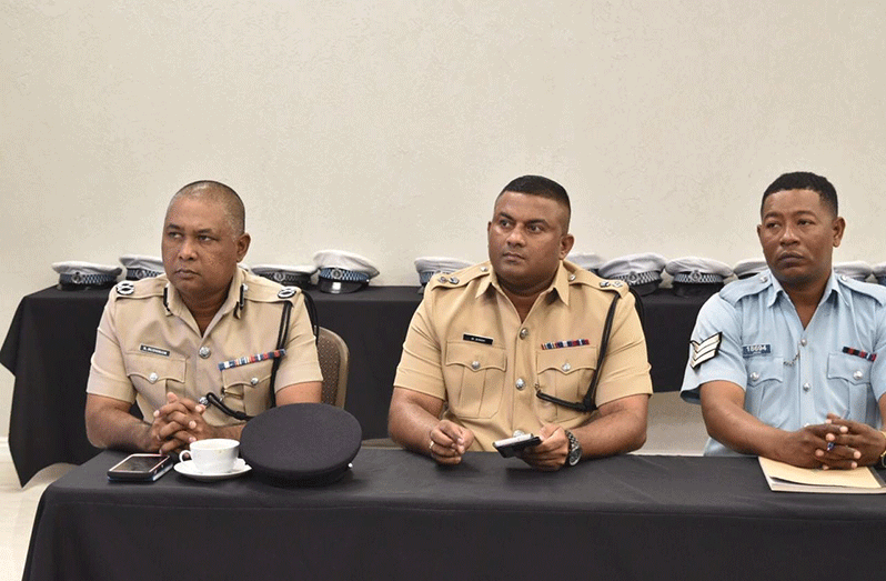 Deputy Commissioner ‘Operations’, Ravindradat Budhram and Traffic Chief, Senior Superintendent Mahendra Singh and a traffic sergeant, during remarks at the training programme