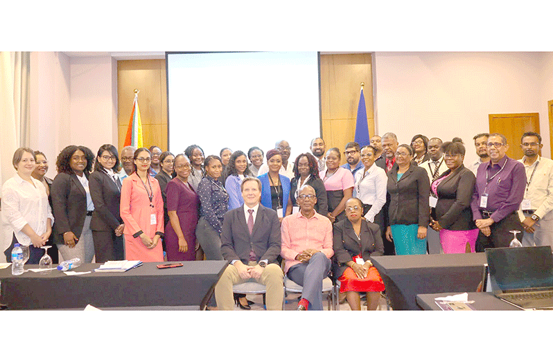 (Seated centre) Minister of Labour, Joseph Hamilton, flanked by Ministerial Adviser to the Ministry of Labour, Gillian Burton-Persaud and ILO Deputy Director, Lars Johansen, with the participants of the workshop