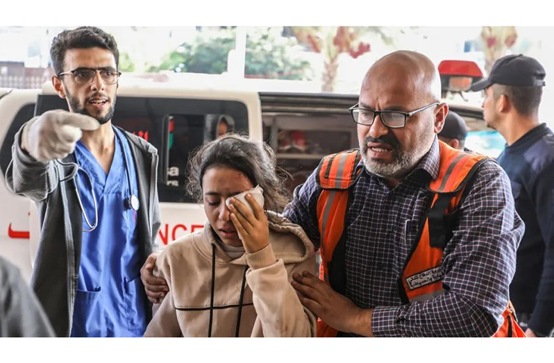 Palestinians injured in Israeli airstrikes arrive at Nasser Medical Hospital in Khan Younis on Saturday