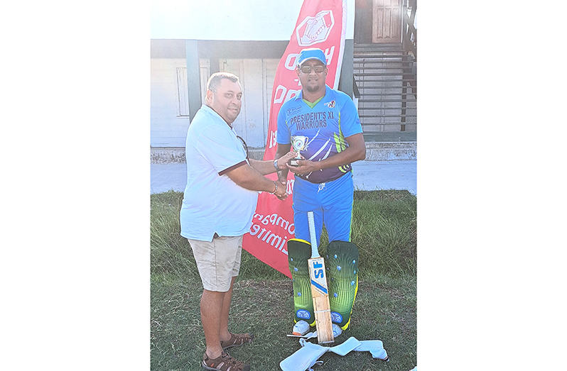 Raj Singh, CEO of Big Man Cricket, presents Richard Latif with Man-of-the-Match trophy