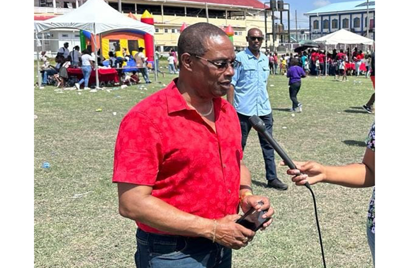 Commissioner Hicken being interviewed at the gift drive (Guyana Police Force photo)