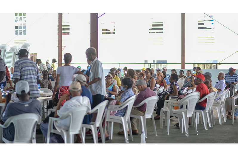 A group of pensioners at Naeem’s Soup Kitchen on Brickdam during Tuesdays distribution (Japheth Savory photo)