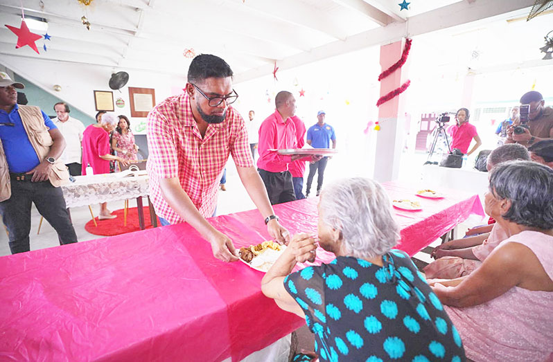 President, Dr. Irfaan Ali on Christmas Day joined the elderly residents of the Dharm Shala for a luncheon, and pledged $1.5 million to support the organisation’s efforts (Office of the President photos)