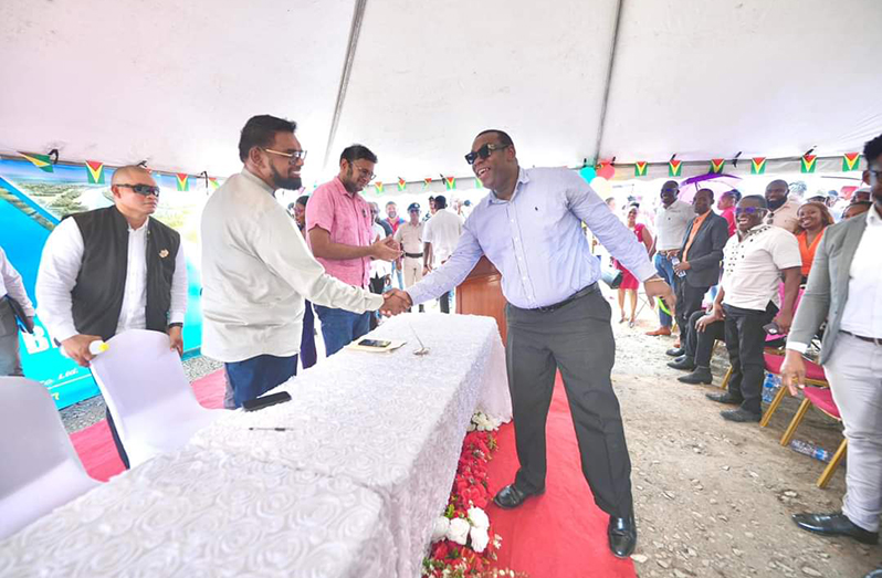 Regional Chairman of Region 10, Deron Adams, engages President, Dr. Irfaan Ali at the signing ceremony for the Mackenzie-Wismar Bridge, on Friday, January 5