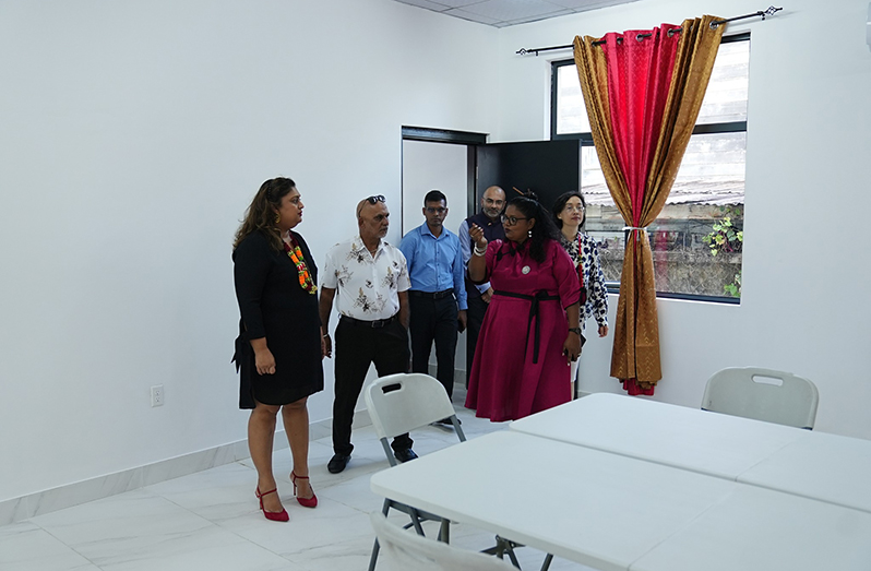 Minister of Education Priya Manickchand and other officials inside the new facility