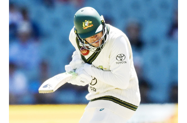 Australia's Usman Khawaja is struck by a delivery from West Indies' Shamar Joseph on the third day of the first Test in Adelaide. Photograph: James Elsby/AP