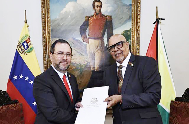 Guyana’s Ambassador to Venezuela, Dr. Richard Van West-Charles (r) presents his letters of credence to Venezuela’s Minister for People’s Power for Foreign Affairs, Yvan Gil