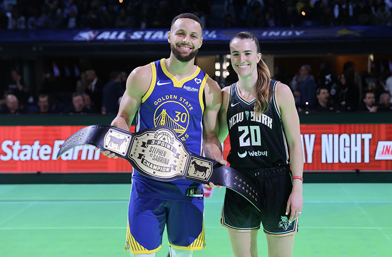 Stephen Curry and Sabrina Ionescu pose for a photo after their 3-point challenge during NBA All-Star festivities on Saturday in Indianapolis.