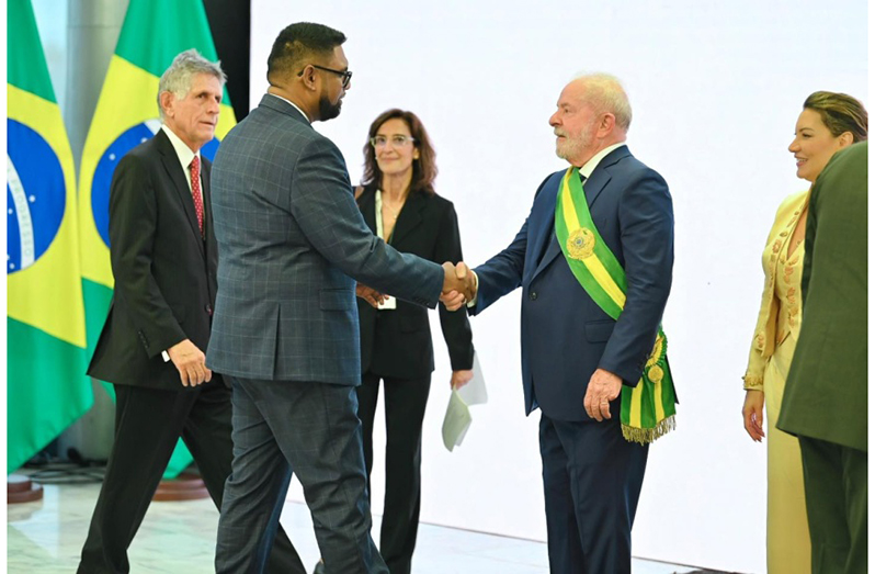 Guyana’s President, Dr. Irfaan Ali, greets Brazilian President, Luiz Inacio Lula da Silva, at his swearing in ceremony recently