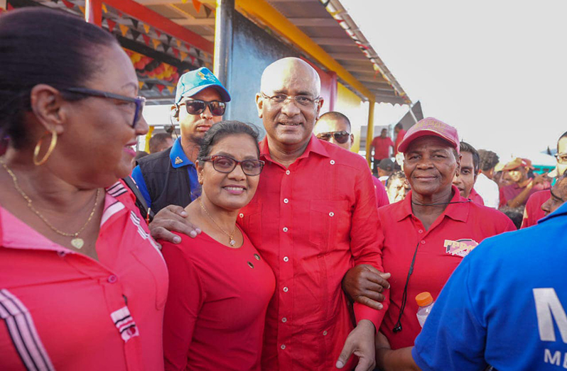 General Secretary of the People's Progressive Party/Civic, Dr Bharrat Jagdeo flanked by supporters at Babu Jaan, Port Mourant