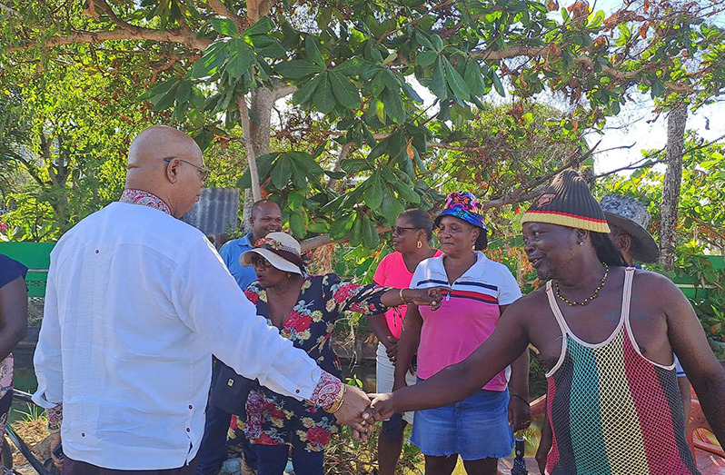 Minister of Public Works Bishop Juan Edghill engaging residents of Nabacalis on Monday