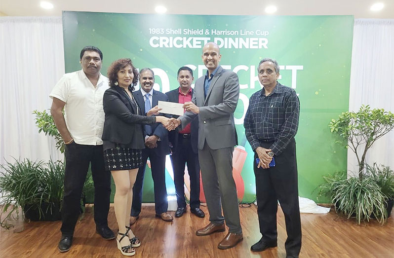 Anita Kallicharran (left) hands over the cheque to Treasurer of the GCB Dr Brian Sukhai