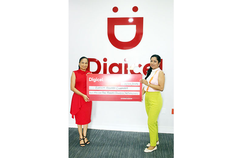 Digicel's Chief Commercial Officer, Ms. Simone Pierre (left) and Regatta Committee Treasurer, Ms. Natalie Tilbury Bobb, displays the cheque.