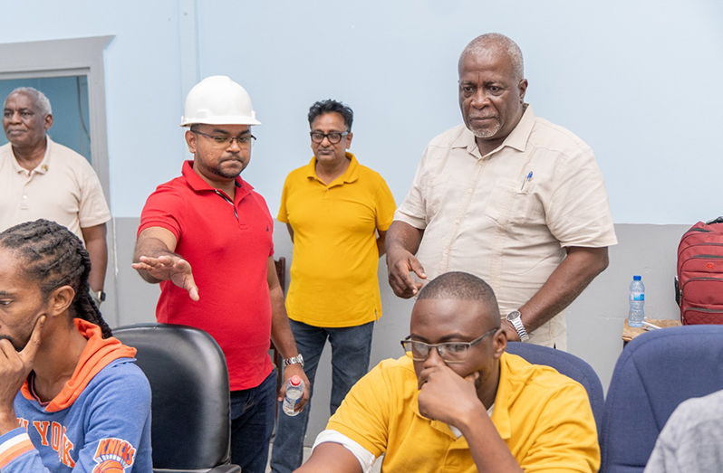 System Control and Operations Manager, Navin Deonarayan and Prime Minister, Brigadier (Ret'd) Mark Phillips, along with a team working to rectify the nationwide power outage