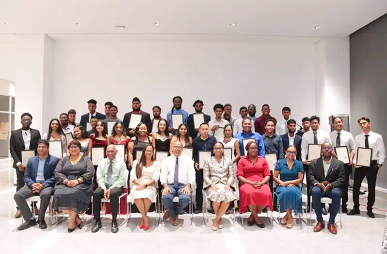 Minister of Health, Dr Frank Anthony poses with graduates of the first batch of the Biomedical Technicians Training