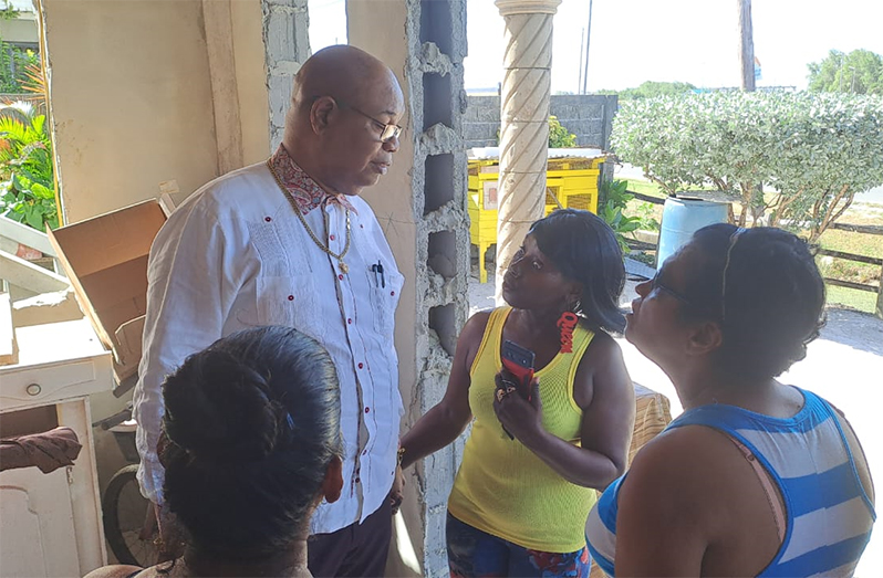 Public Works Minister Juan Edghill on Monday met residents of Dochfour after receiving complaints of the road construction damaging properties in the area (Public Works Ministry photos)