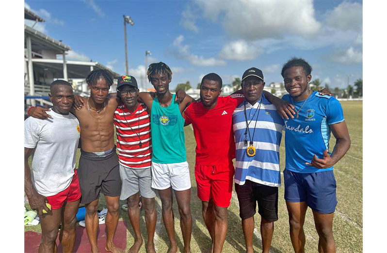 Members of the 4x100m team, along with coaches, after a training session at the Police Sports Club ground, Eve Leary