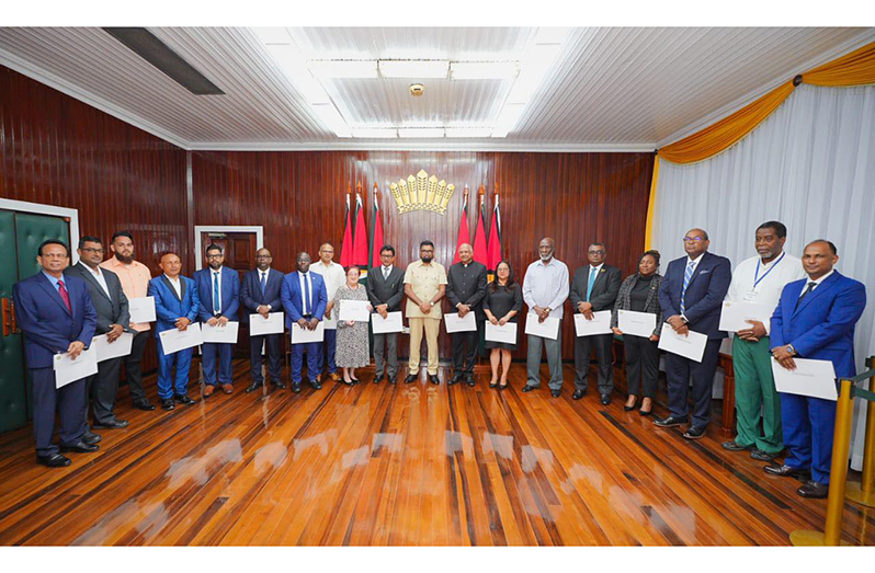President Dr Irfaan Ali flanked by the newly appointed members of the Constitutional Reform Commission (CRC) (Office of the President photo)
