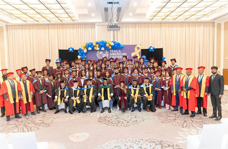 Prime Minister Brigadier (Ret'd), Mark Phillips and university officials with the graduating class