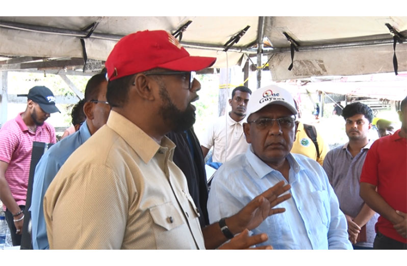 President of Guyana, Dr. Mohamed Irfaan Ali, and the Minister of Agriculture, Zulfikar Mustapha, in one of their recent meetings with farmers and residents