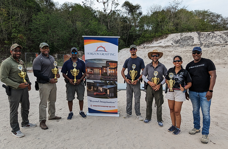 Mr Winston Hermanstyne, Business Development Manager of Horizon Group Inc poses with the prize winners at the Guyana Sport Shooting Foundation's Practical Shooting Match