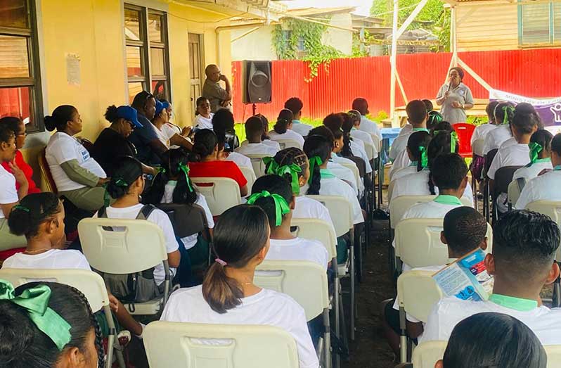 Ministerial Adviser within the Ministry of Labour, Gillian Burton Persaud speaking to a section of the gathering at Port Kaituma district in Region One (Barima-Waini)