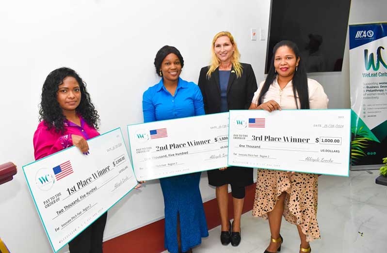 US Ambassador to Guyana, Nicole Theriot with the winners of the competition, Amanda Edwards, Sarah Baird and Jacqueline Success