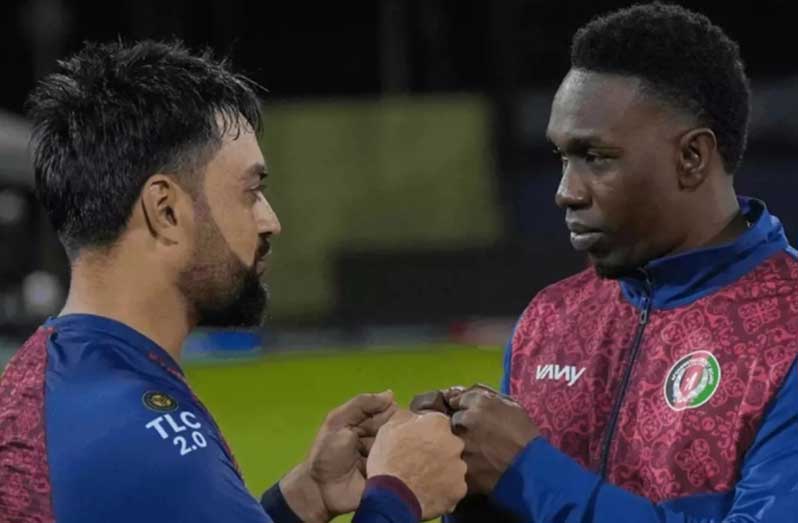 Dwayne Bravo (right) and Afghanistan captain Rashid Khan