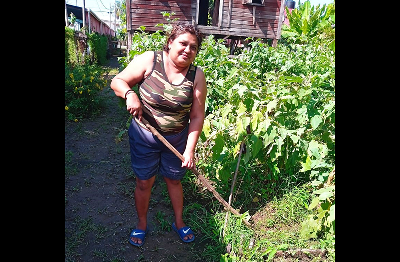 Kavita Abdool tending to her crops