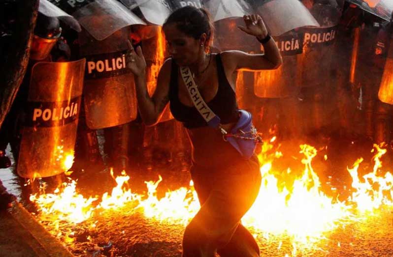 Venezuela's security forces clashed with large crowds of protesters who took to the streets to denounce the re-election of President Maduro as fraudulent (Reuters photo)