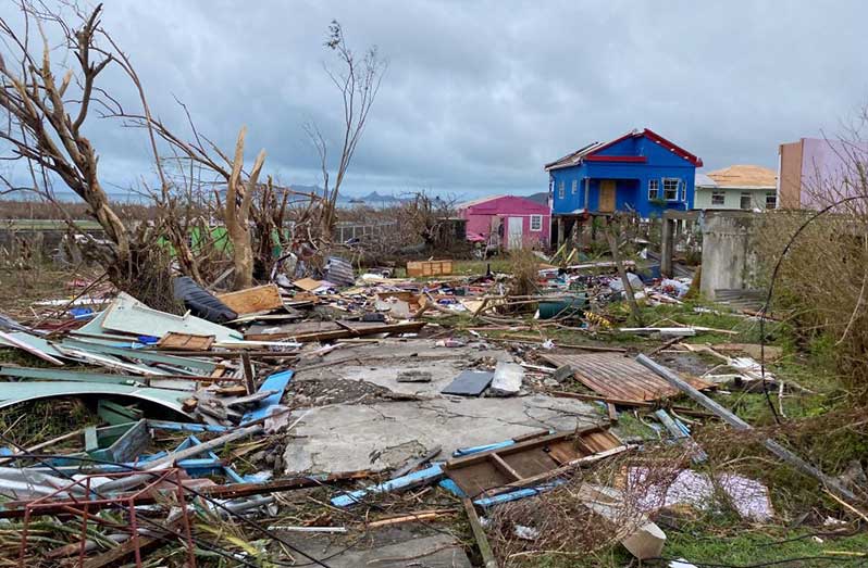 Debris around the foundation of a destroyed house on the island of Carriacou, Grenada, on July 3, after Hurricane Beryl. Bishop Clyde Harvey, of St. George's, in Grenada, travelled by boat to visit the island of Carriacou on July 12 (OSV News/Reuters/Arthur Daniel)