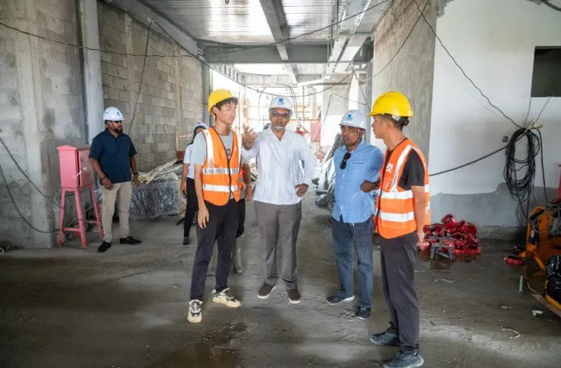 Minister of Health Dr Frank Anthony (second from left) inspects construction work at the new Diamond Smart Hospital