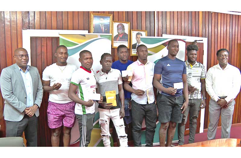 Award winners of the One Guyana President’s Cup is flanked by Director of Sport Steve Ninvalle and Assistant Director Franklyn Wilson