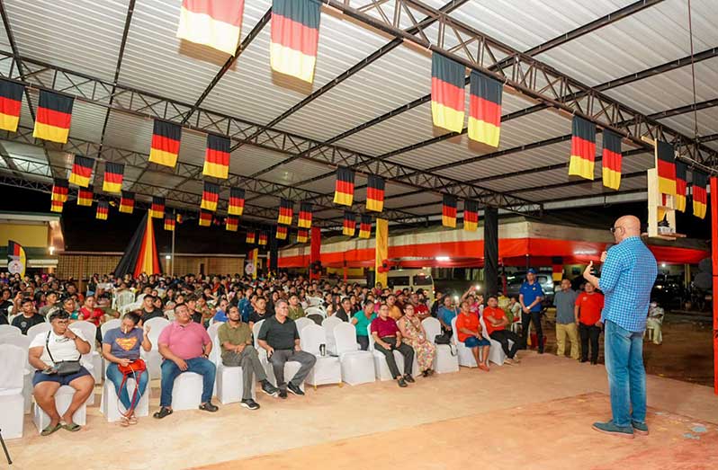 Dr. Bharrat Jagdeo addressing youths at the PYO youth camp in St. Ignatius, Region Nine