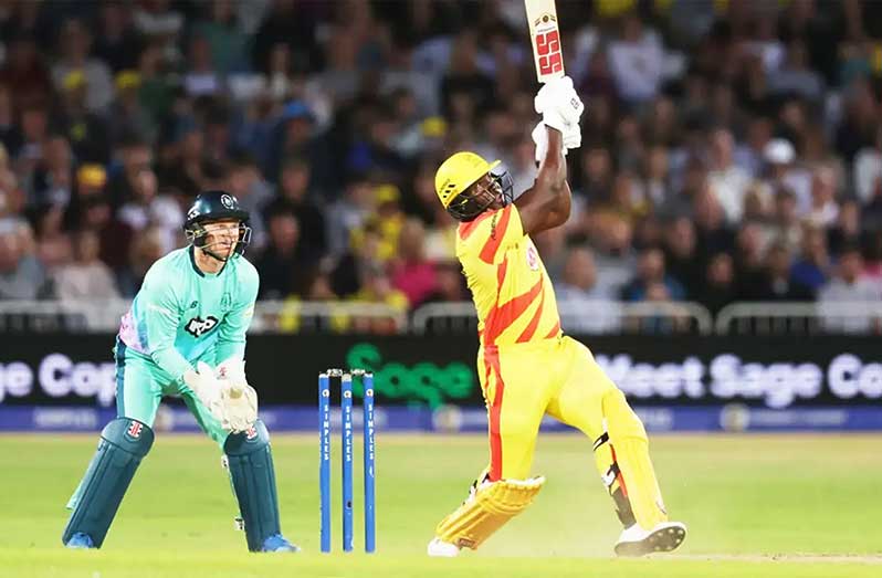 Rovman Powell launches a six over wide long-on  •  Nathan Stirk/ECB via Getty Images