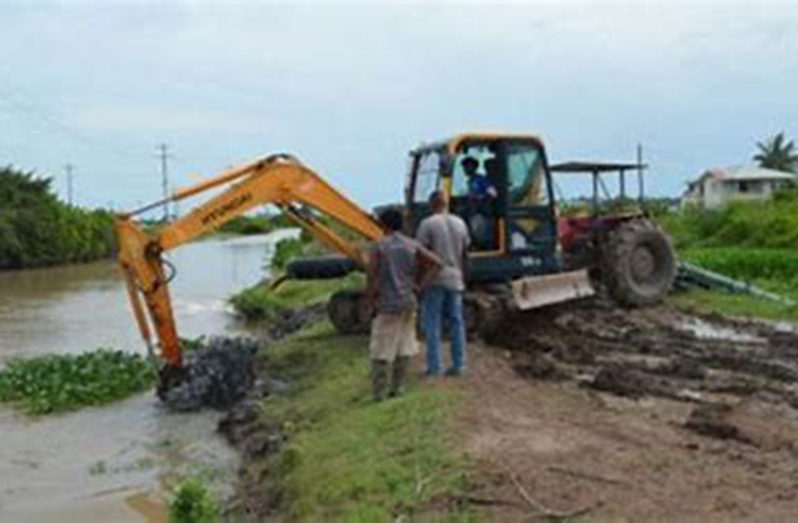 A drainage canal being cleared