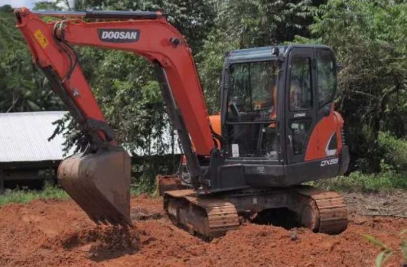 A trainee operating a machine