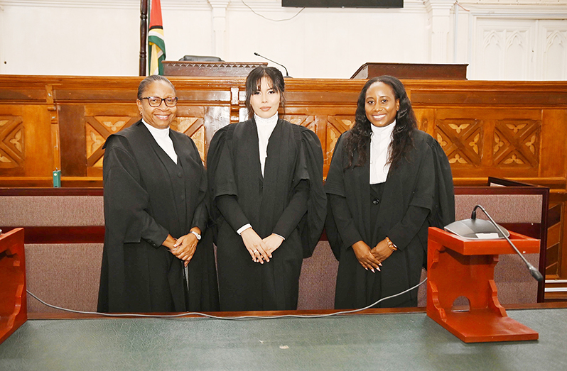 Attorney-at-Law, Paula Gomes, is flanked by Chief Justice (ag) Roxane George, SC (left) and attorney-at-Law Oneka Archer-Caulder