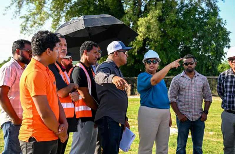 Minister Manickchand speaks to some of the contractors that are building schools in the country