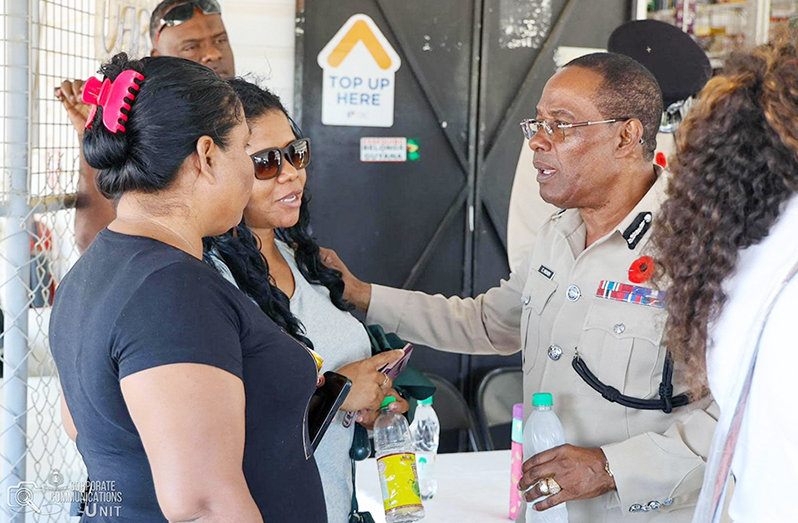 Commissioner of Police, Clifton Hicken, interacts with residents of Region Two