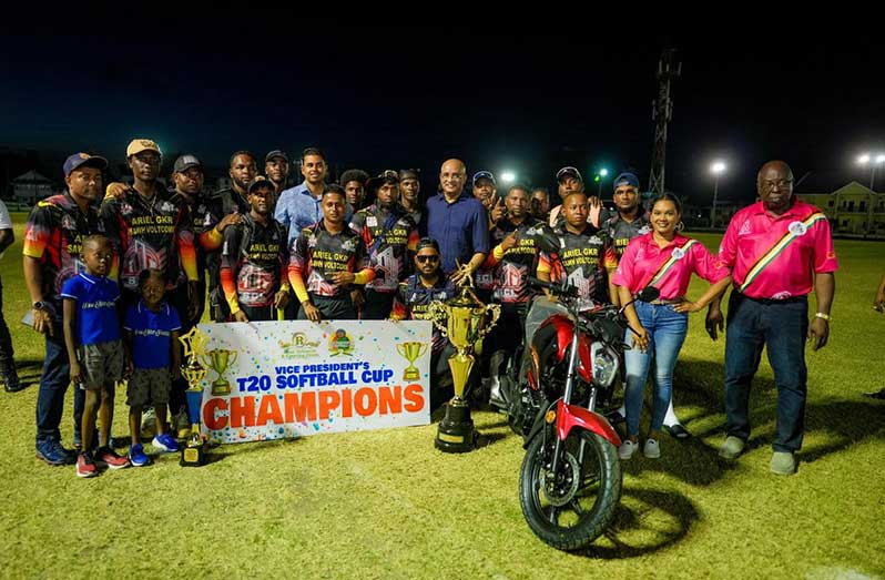 The victorious Ariel Guyana Knight Riders players pose with their winnings. MVP Troy Drakes is next to his winning motorcycle