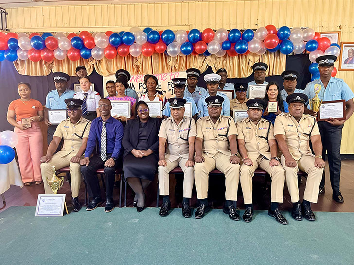 Deputy Commissioner ‘Administration’, Mr. Ravindradat Budhram (seated centre) next to divisional commander, Superintendent Guy Nurse, Traffic Chief, Senior Superintendent Mahendra Singh and other officials flanked by the awardees